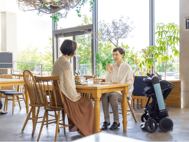 WHILL customer enjoying personal mobility outdoors