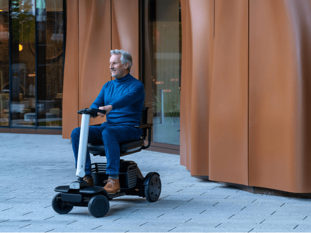 WHILL user exploring the city with a personal mobility device