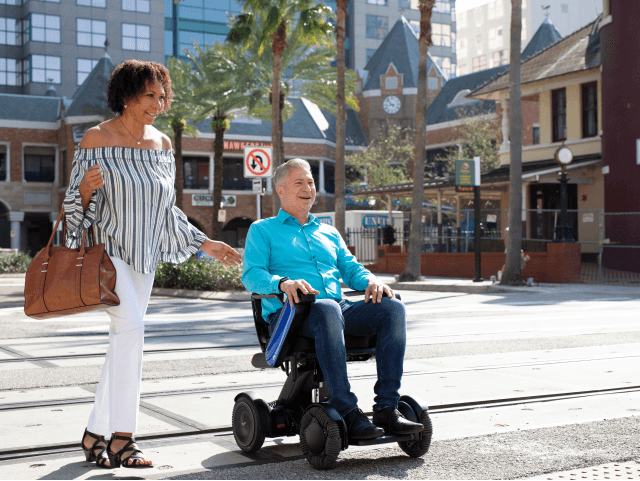 WHILL customer experiencing freedom of movement with a power wheelchair