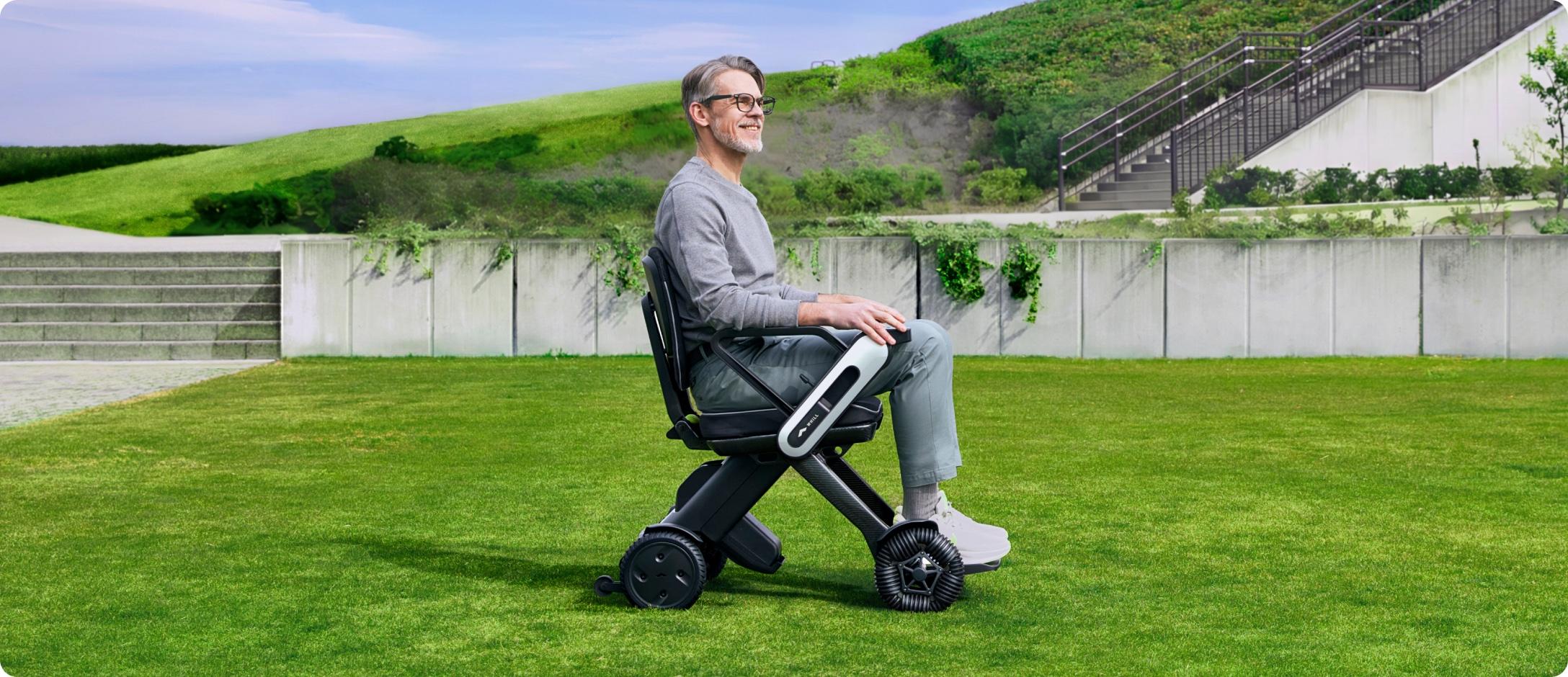 WHILL Model C Lite driving over uneven terrain