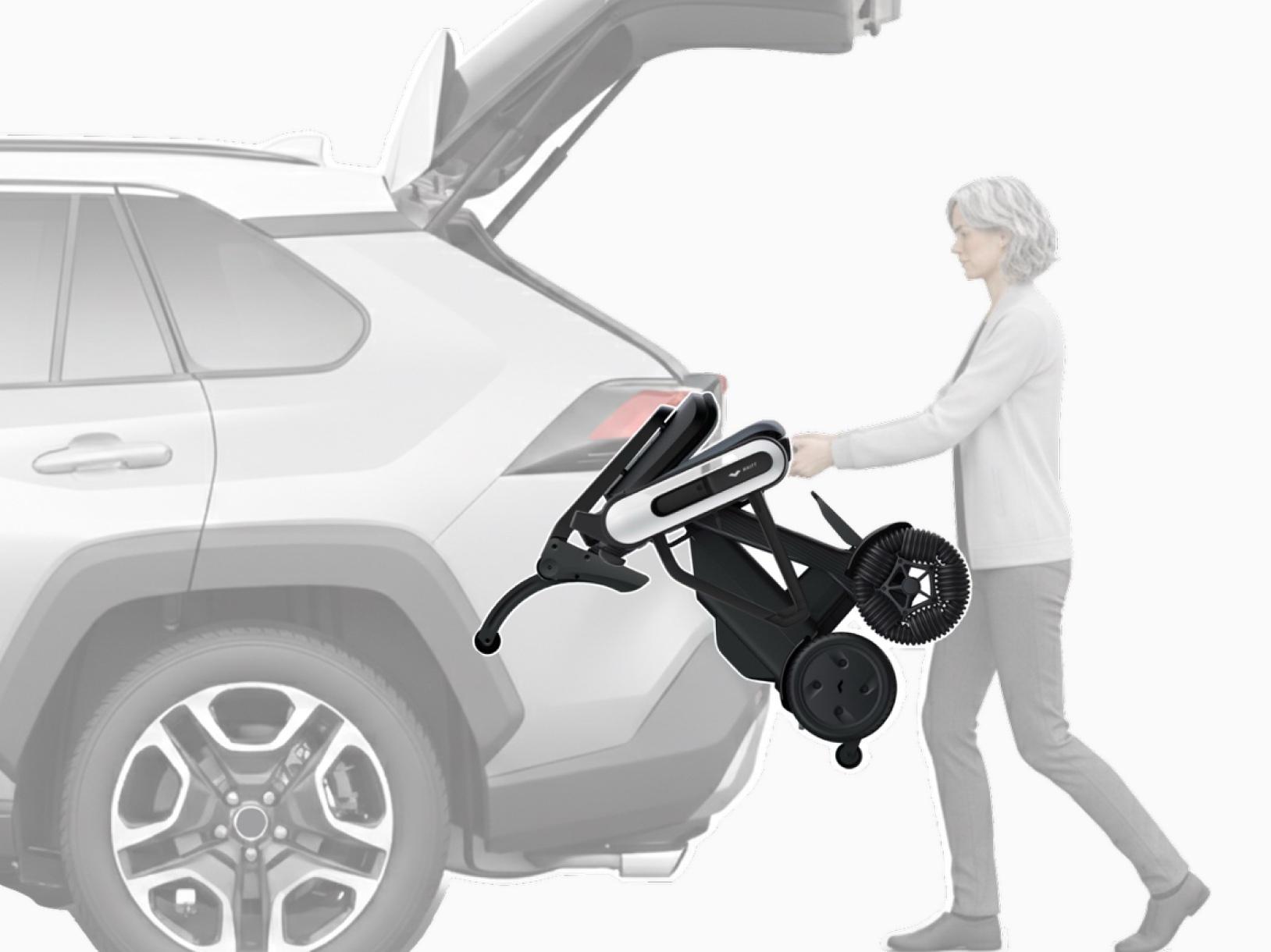 WHILL Model C Lite being loaded into a car with the loading attachment
