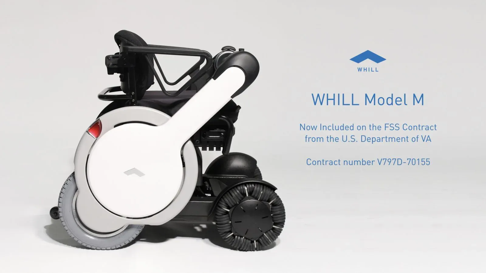 Sleek side view of a WHILL Model M power chair mobility device, showcasing large wheels and minimalist design. Includes text about VA contract and WHILL logo on the right.