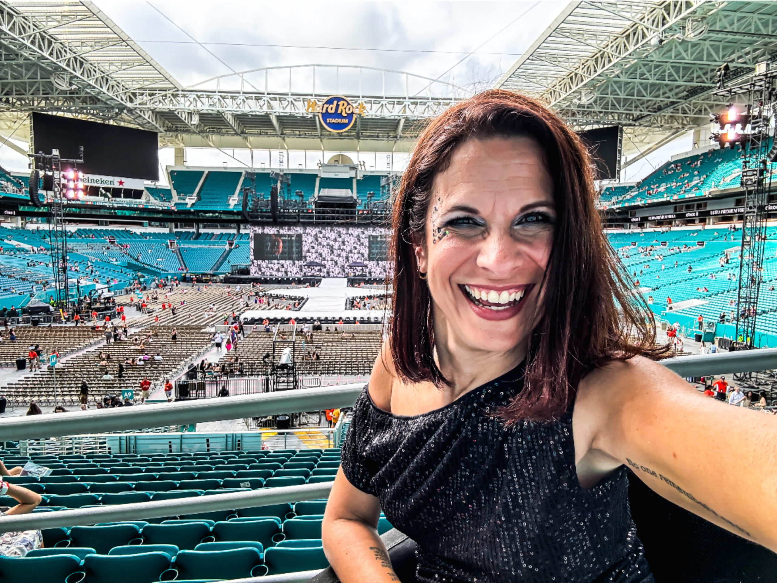 Woman in a WHILL Model C2 powerchair at a Taylor Swift concert.
