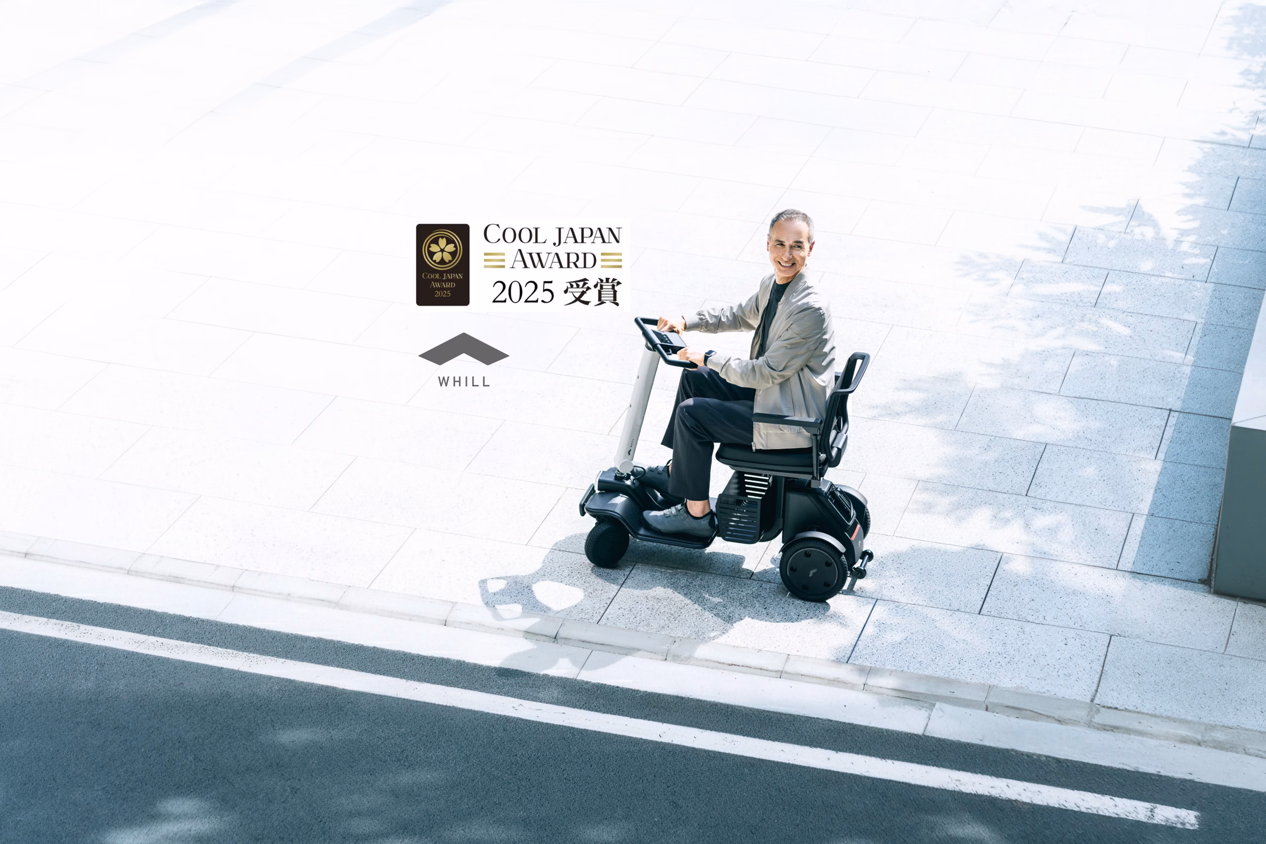 Man in the WHILL Model R mobility scooter