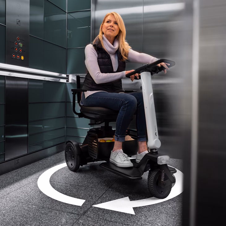 A women using WHILL Model R3 showing the turning radius of the scooter